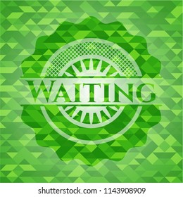 Waiting green emblem with triangle mosaic background