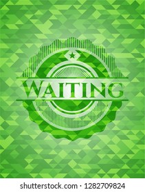 Waiting green emblem with triangle mosaic background