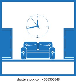 waiting room sofa in front of the door and a clock on the wall 