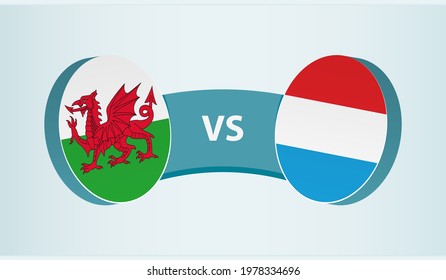 Wales versus Luxembourg, team sports competition concept. Round flag of countries.