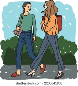 walking and talking women in the park 
