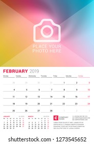 Wall calendar for February 2019. Vector design print template with place for photo. Week starts on Monday