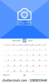 Wall calendar for January 2019. Vector design print template with place for photo. Week starts on Sunday. Portrait orientation