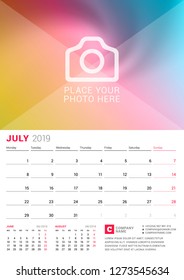 Wall calendar for July 2019. Vector design print template with place for photo. Week starts on Monday