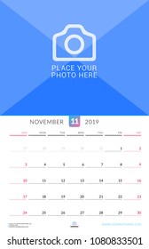 Wall calendar for November 2019. Vector design print template with place for photo. Week starts on Sunday. Portrait orientation