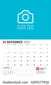 Wall calendar planner for 2019 year. November. Vector print template with place for photo. Week starts on Sunday