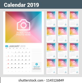 Wall calendar planner template for 2019 year. Vector design print template with place for photo. Week starts on Sunday