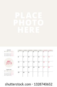 Wall calendar planner template for July 2019. Week starts on Monday. Vector illustration. Stationery print design