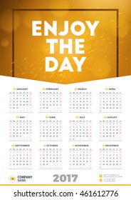 Wall Calendar Poster for 2017 Year. Vector Design Print Template with Typographic Motivational Quote on Yellow Background. Enjoy the day