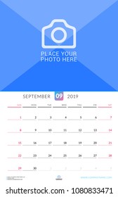 Wall calendar for September 2019. Vector design print template with place for photo. Week starts on Sunday. Portrait orientation