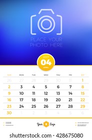 Wall Calendar Template for 2017 Year. April. Vector Design Template with Place for Photo. Week starts Sunday. Portrait Orientation