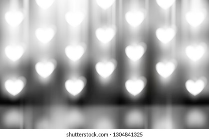 Wall of glowing hearts. Studio background for displaying product design. Advertising web banner with light effect