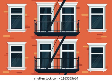 Wall of house with windows and stairs
