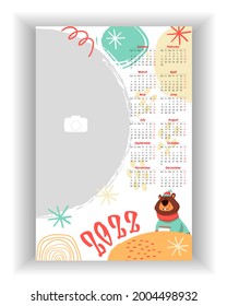 Wall Monthly Photo Calendar 2022. Simple, colorful, baby birthday vertical photo calendar template. Calendar design 2022 year in English. Week starts from Monday. Vector illustration