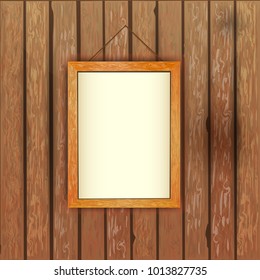 Wall of old dark boards with a picture in a bright frame and white linen