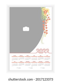 Wall Photo Calendar 2022. Beautiful, elegant, floral vertical photo calendar template. Calendar design 2022 year in English. Week starts from Sunday. Vector illustration