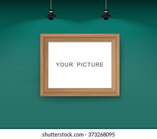 Wall with picture frame. Vector illustration of green wall with spotlight.