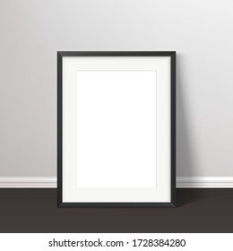 Wall poster realistic mockup. Black frame standing on the floor with passepartou mock up. Vector illustration.