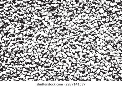 The wall of stones is laid out in a mosaic. Black and white shades