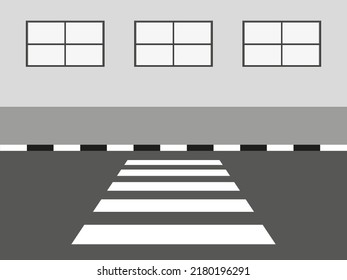 Wall with windows, sidewalk and crosswalk