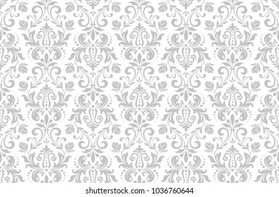 Wallpaper in the style of Baroque. A seamless vector background. White and grey floral ornament. Graphic pattern for fabric, wallpaper, packaging. Ornate Damask flower ornament.