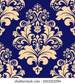 Wallpaper in the style of Baroque. A seamless vector background. Dark blue and gold floral ornament. Graphic pattern for fabric, wallpaper, packaging. Ornate Damask flower ornament