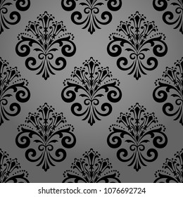 Wallpaper in the style of Baroque. A seamless vector background. Black floral ornament. Graphic pattern for fabric, wallpaper, packaging. Ornate Damask flower ornament