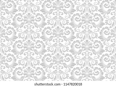 Wallpaper in the style of Baroque. Seamless vector background. White and grey floral ornament. Graphic pattern for fabric, wallpaper, packaging. Ornate Damask flower ornament.