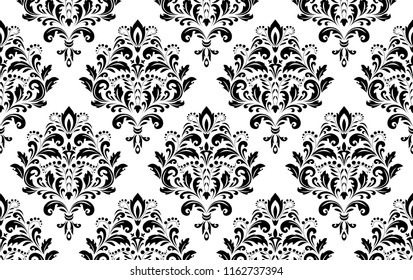 Wallpaper in the style of Baroque. Seamless vector background. White and black floral ornament. Graphic pattern for fabric, wallpaper, packaging. Ornate Damask flower ornament
