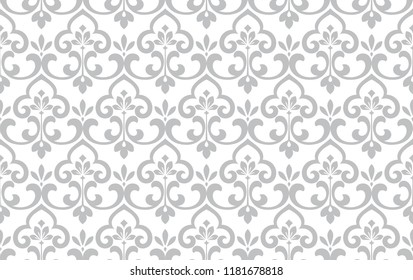 Wallpaper in the style of Baroque. Seamless vector background. White and grey floral ornament. Graphic pattern for fabric, wallpaper, packaging. Ornate Damask flower ornament.
