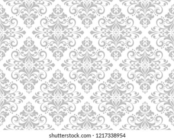 Wallpaper in the style of Baroque. Seamless vector background. White and grey floral ornament. Graphic pattern for fabric, wallpaper, packaging. Ornate Damask flower ornament.