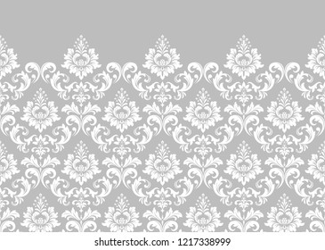 Wallpaper in the style of Baroque. Seamless vector background. White and grey floral ornament. Graphic pattern for fabric, wallpaper, packaging. Ornate Damask flower ornament.