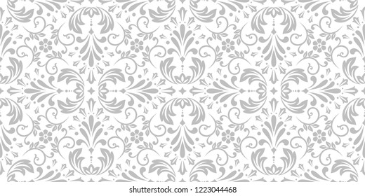 Wallpaper in the style of Baroque. Seamless vector background. White and grey floral ornament. Graphic pattern for fabric, wallpaper, packaging. Ornate Damask flower ornament.