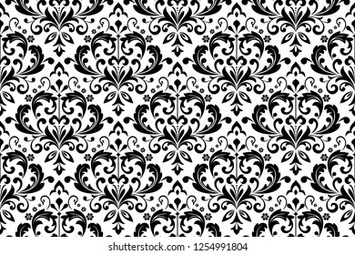 Wallpaper in the style of Baroque. Seamless vector background. White and black floral ornament. Graphic pattern for fabric, wallpaper, packaging. Ornate Damask flower ornament