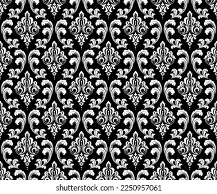 Wallpaper in the style of Baroque. Seamless vector background. White and black floral ornament. Graphic pattern for fabric, wallpaper, packaging. Ornate Damask flower ornament