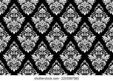 Wallpaper in the style of Baroque. Seamless vector background. White and black floral ornament. Graphic pattern for fabric, wallpaper, packaging. Ornate Damask flower ornament