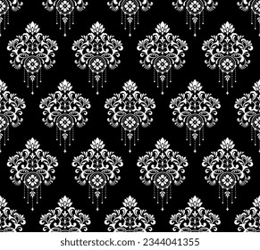 Wallpaper in the style of Baroque. Seamless vector background. White and black floral ornament. Graphic pattern for fabric, wallpaper, packaging. Ornate Damask flower ornament
