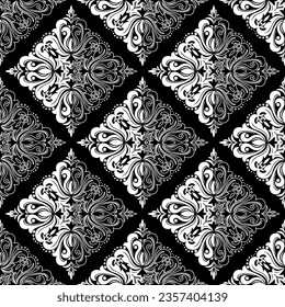 Wallpaper in the style of Baroque. Seamless vector background. White and black floral ornament. Graphic pattern for fabric, wallpaper, packaging. Ornate Damask flower ornament