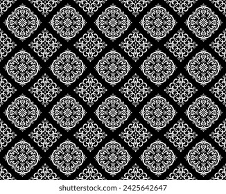 Wallpaper in the style of Baroque. Seamless vector background. White and black floral ornament. Graphic pattern for fabric, wallpaper, packaging. Ornate Damask flower ornament