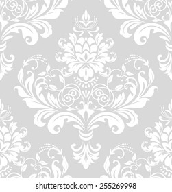 Wallpaper in the style of Baroque. A seamless vector background. Gray and white  floral ornament.