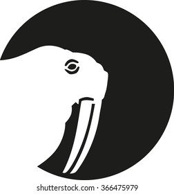 Walrus head silhouette in front of moon