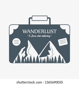 wanderlust label with forest scene in suitcase