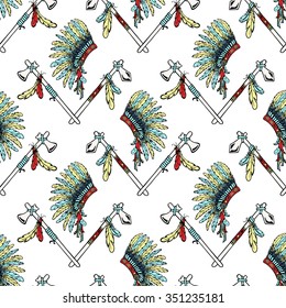

War bonnet, Tomahawk, feather birds. Ethnic seamless pattern vector illustration.
