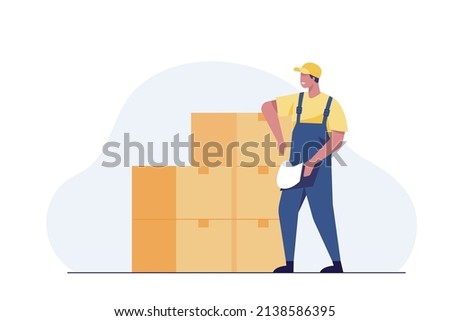 warehouse worker checking boxes in warehouse.