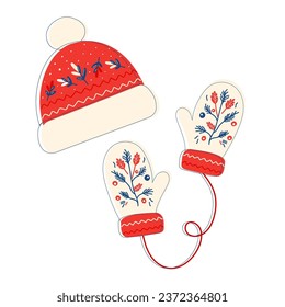 Warm clothes, gloves and hats, knitted accessories, Christmas patterns, New Year. Winter mittens and hat in christmas colors isolated on white background.