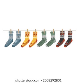 Warm and Cozy Christmas socks pinned on a clothesline. Winter laundry drying in a rope or Xmas gift boots. Isolated New Year home decorative element in eco style, vector illustration.