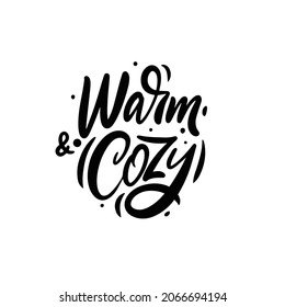 Warm and cozy. Modern motivation winter phrase. Black color calligraphy. Vector poster or card.