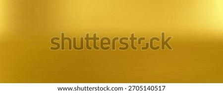 Warm gradient bg shows smooth reflection and depth from gold brass texture. Glossy polished surface enhances gold brass texture for elegant packaging.
