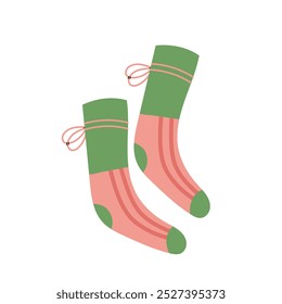 Warm green and pink socks isolated on white background. Autumn and winter cozy season. Accessorize. Christmas and New Year time.