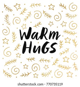 Warm hugs - trendy brush hand lettering with gold holiday elements. Greeting card for the winter season. Vector illustration.

